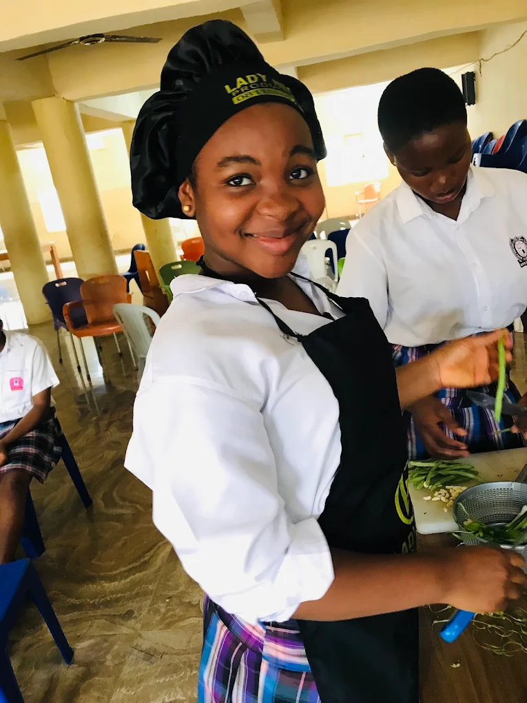 Maryvincent Excellent School student participating in Catering and Craft practicals